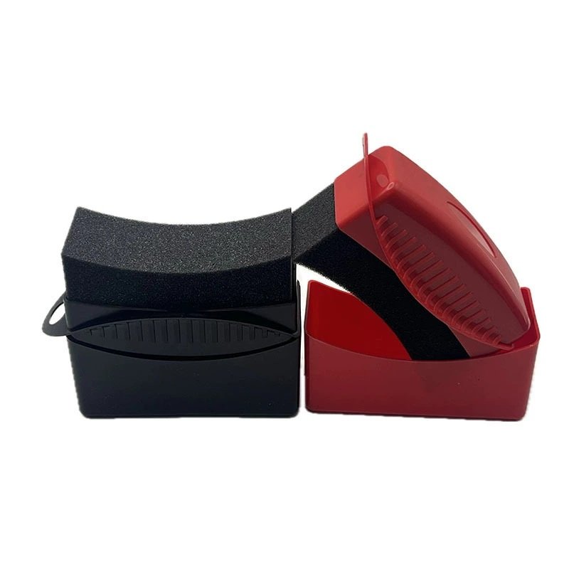 Red and black curved tire dressing applicators with storage cases